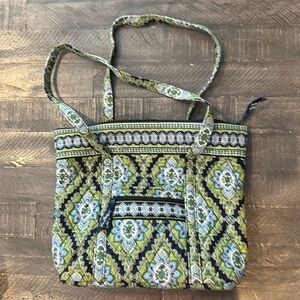 Vera Bradley one outside pocket zipper closure to inside pockets